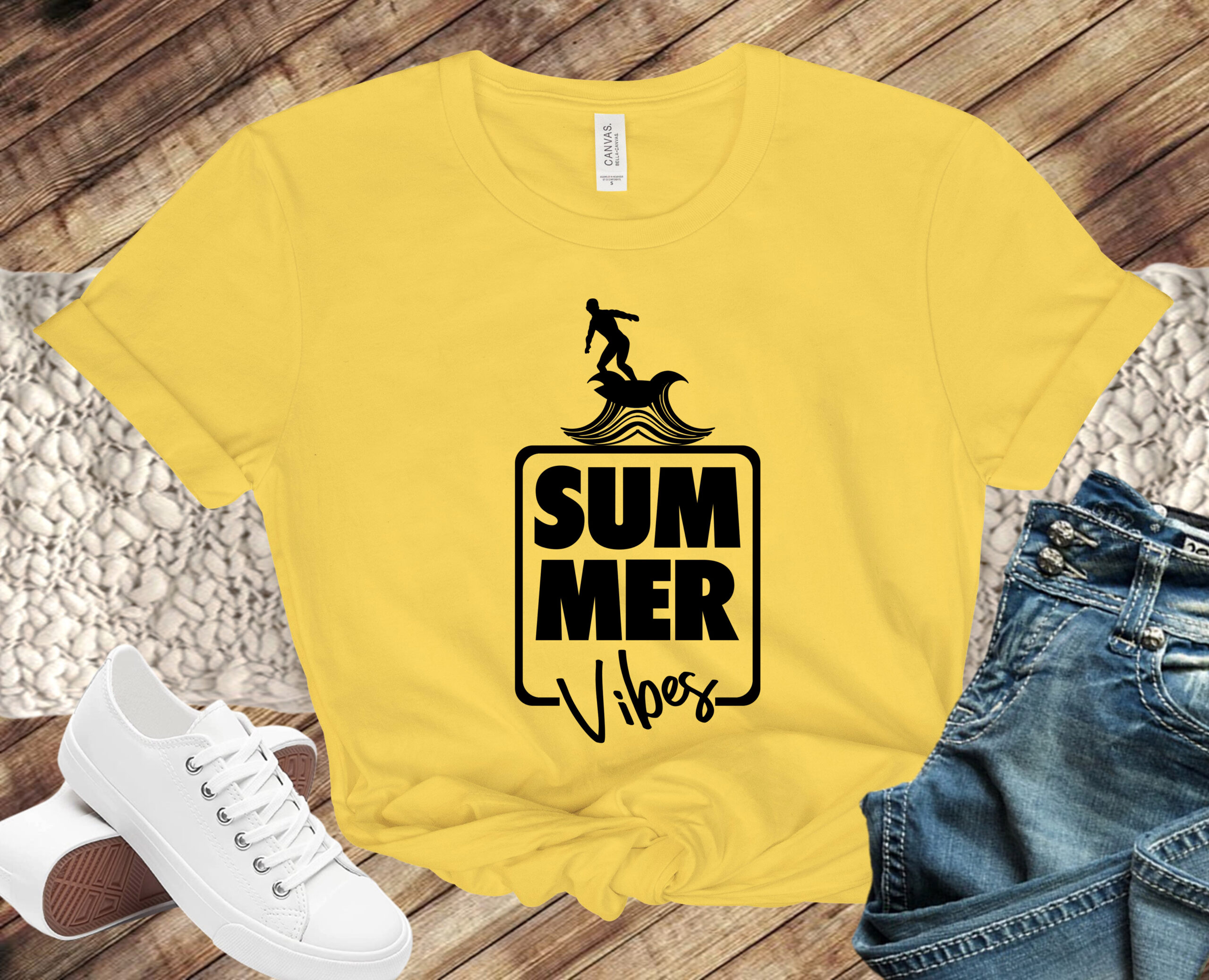 Free Summer Vibes SVG File written on a yellow T shirt.