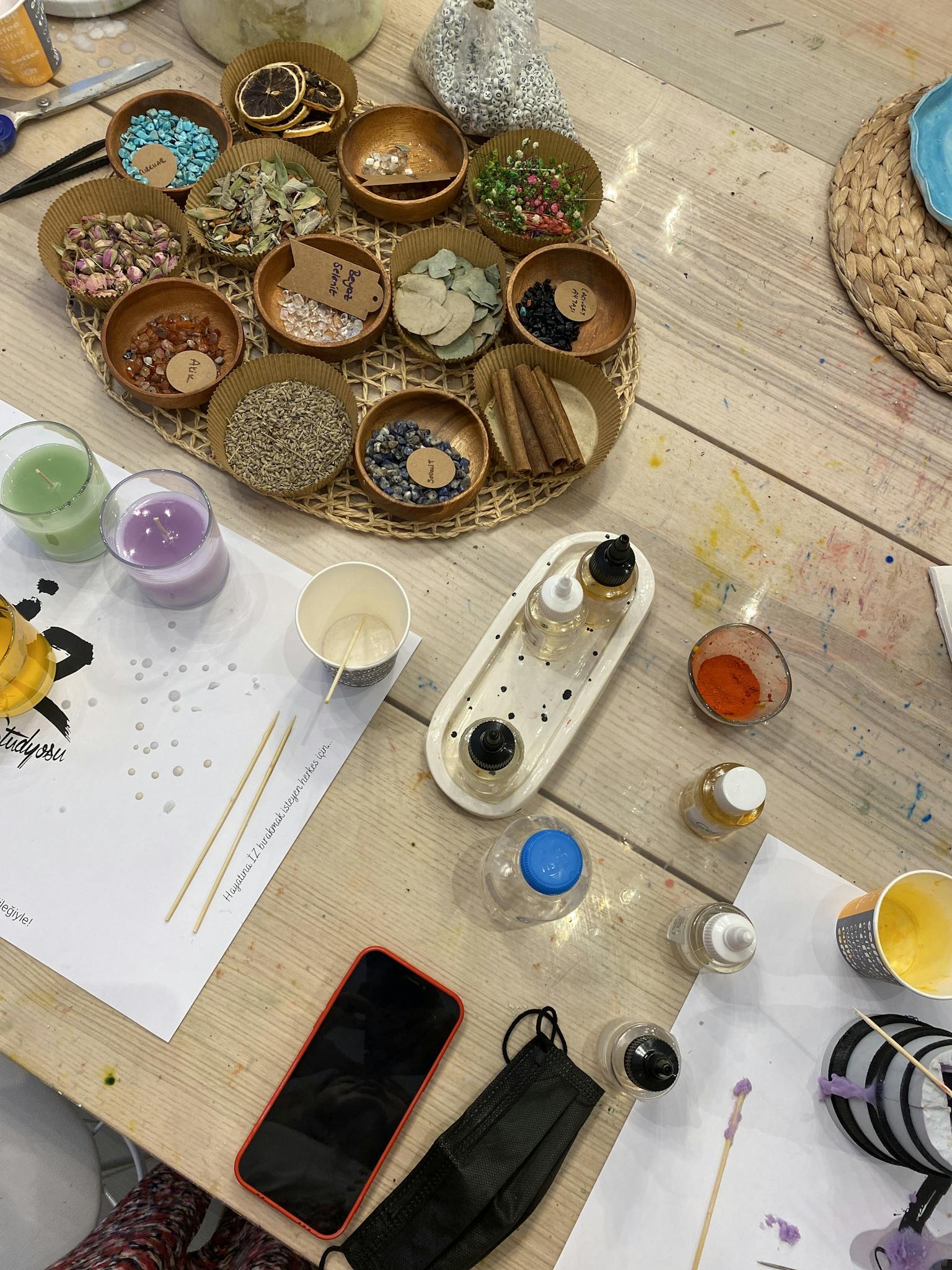 a colorful table with craft supplies for